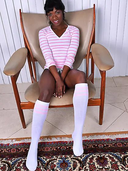 Ebony MILF Ana Foxxx in striped T-shirt and white socks shows of