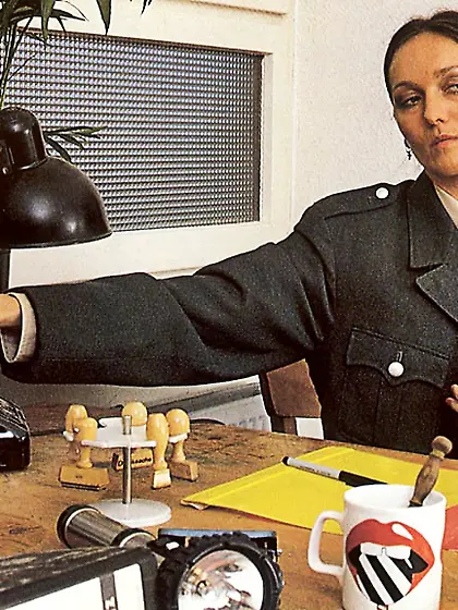 Seventies cop inspecting victim