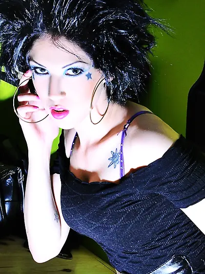 Hedonistic rock temptress with a bat unveils her cunt and finger