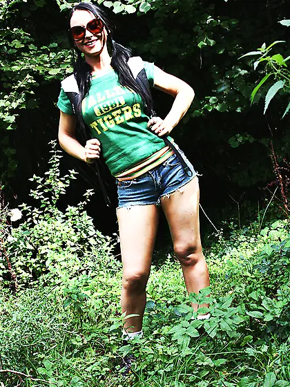 Adventurous brunette wearing green