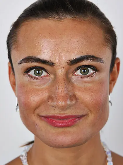 Female with green eyes wears white pants and bra but black panti