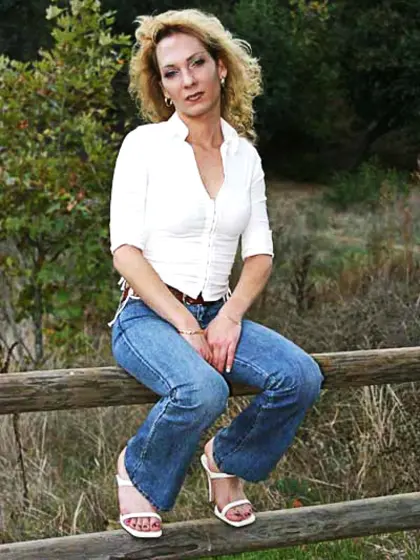 Blonde tranny in a sexy red skirt shows off