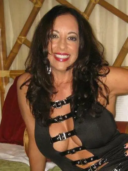 Virginia strikes a pose while showing her tits