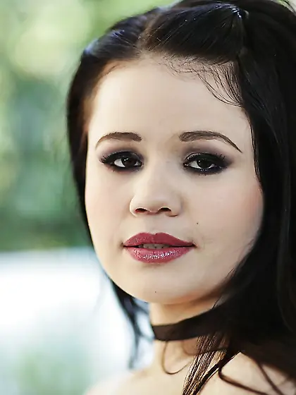 Barely legal brunette takes off top and skirt to pose in stockin