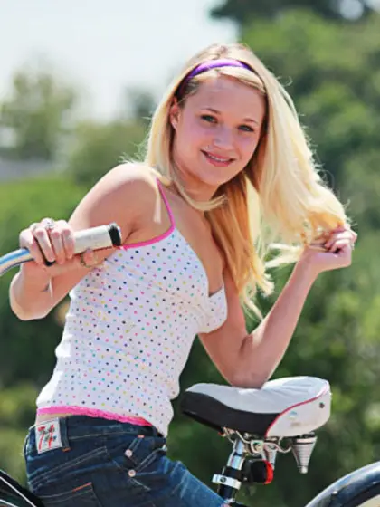 Playful blonde haired teenage chick Teagan Summers strips naked