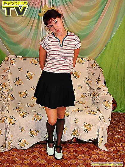 Cute teen drinks own pissing