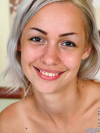 Smiling blonde teen Kelly Nubiles shoves jet black toy in her sm