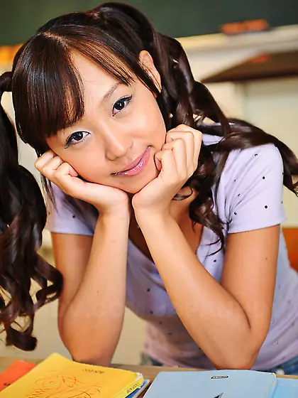Cheerful Japanese coed with pigtails is shy about showing tits a