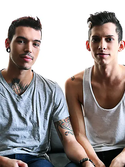 Gay dude tattoos sits