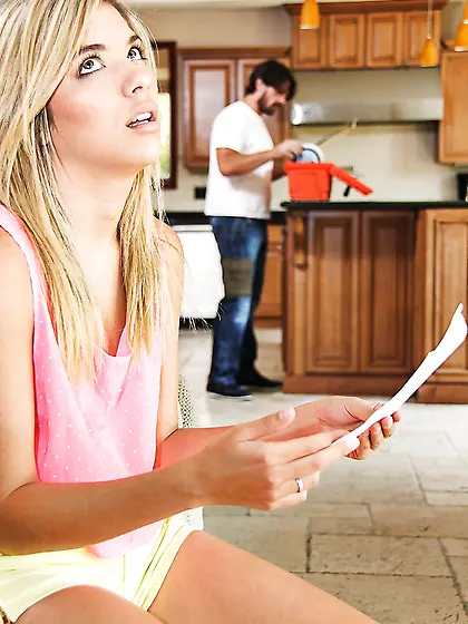 Charming blonde teen seduces handsome plumber at the kitchen whi
