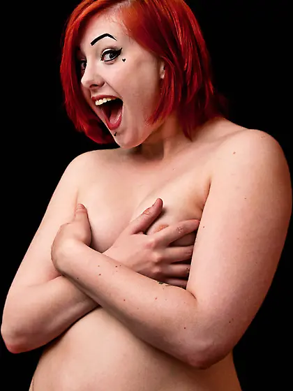 Embarrassed covering redhead