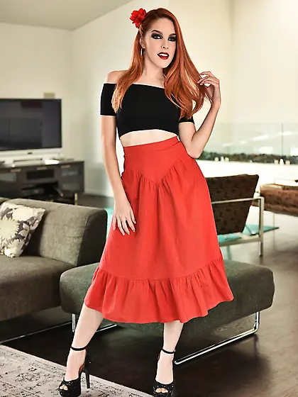 Naked Spanish girl's hair and lips are as red as the flower on h