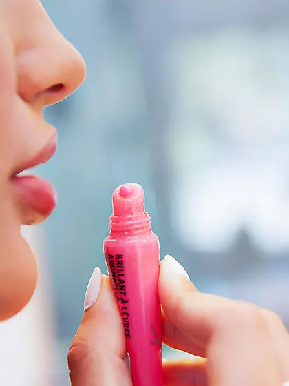 Tanned brunette with short hair eating her girlfriend's pre