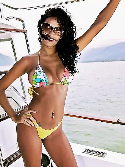 Curly-haired and exotic-looking brunette gets banged on a boat