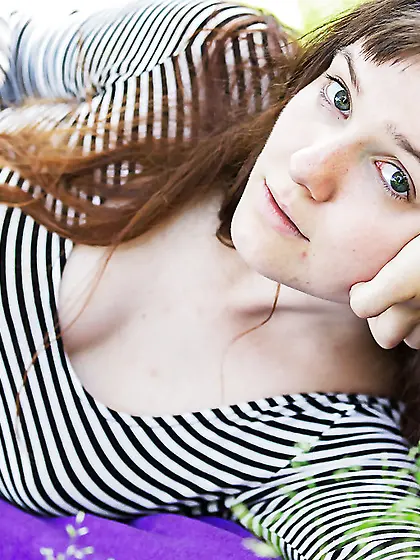 Cute girl with bangs is prepping to showcase her hot bush