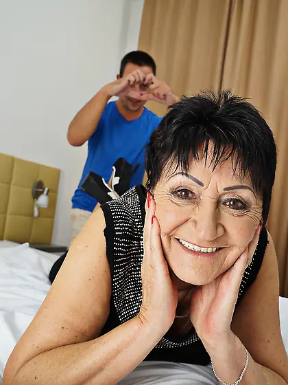 Mature woman gets a facial from a toyboy