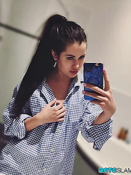 Russian girl Cassie Fire enjoys self-contemplation and self-dona