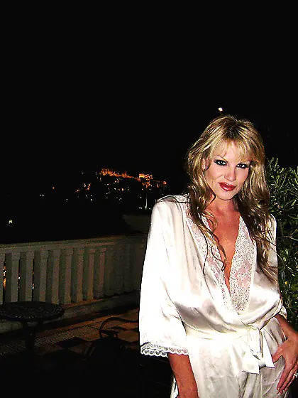 Big breasted blonde Kelly Madison takes off her satin robe and s