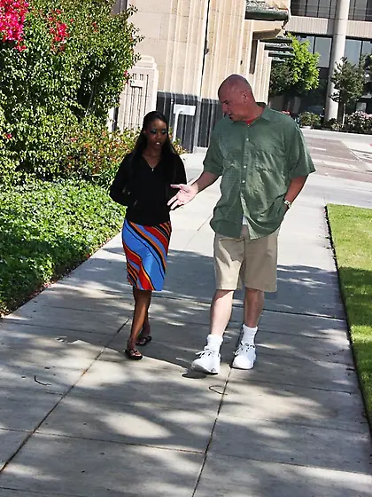 Black girl Nina Devon looks great in red fishnets and she easily