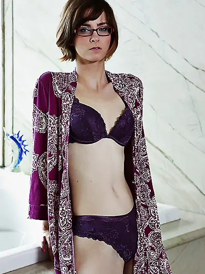 Lecherous female with glasses exposes her pale body and hairy ch