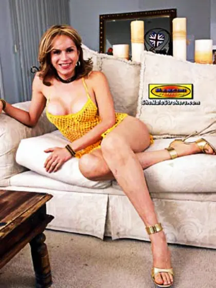 Blonde tranny in a yellow outfit showing...