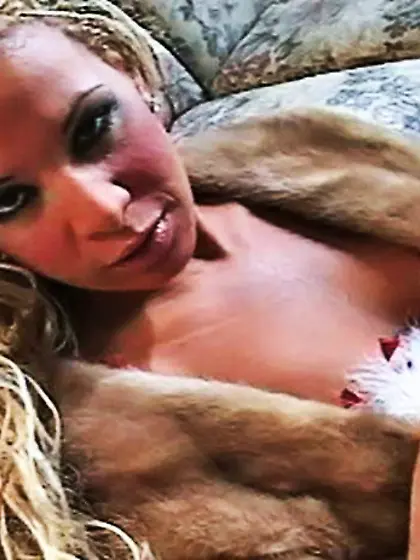 Slutty blonde in a fur coat likes to smoke...