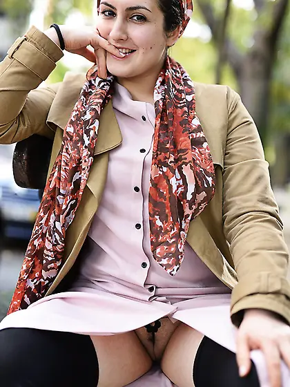 Shy-looking babe exposing her sexy panties and pussy while in pu