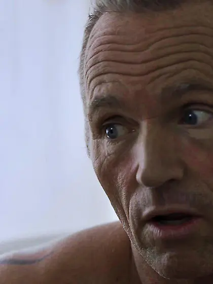 Wife watches husband and friend