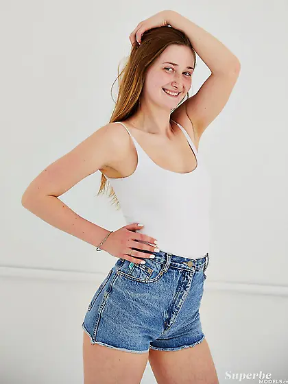 Perky redhead teen poses for camera joyfully