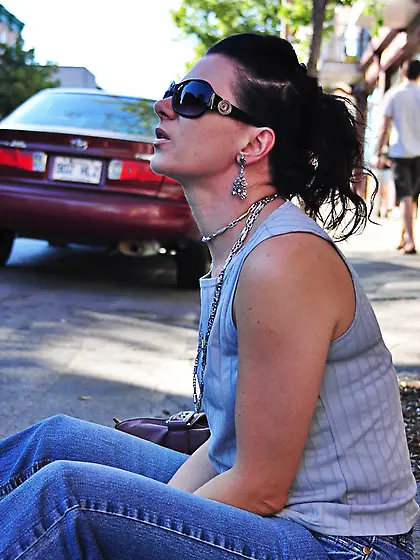 Gorgeous brunette sunglasses smokes