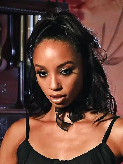 Sexy ebony in high boots masturbates on the floor