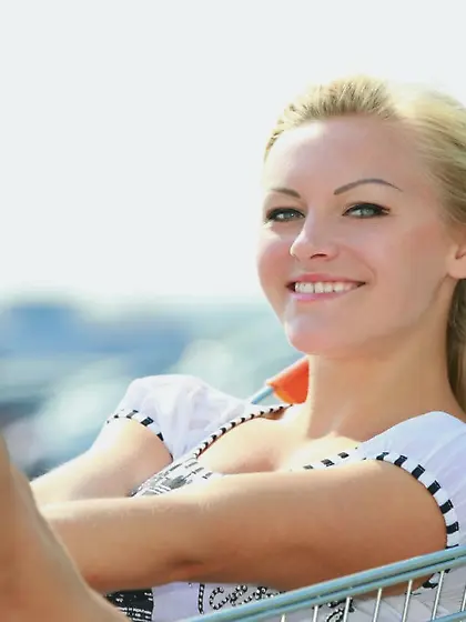 Happy-go-lucky blondie rides in a shopping cart and poses naked