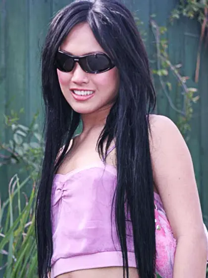 Slender brunette Asian tranny shows her big...
