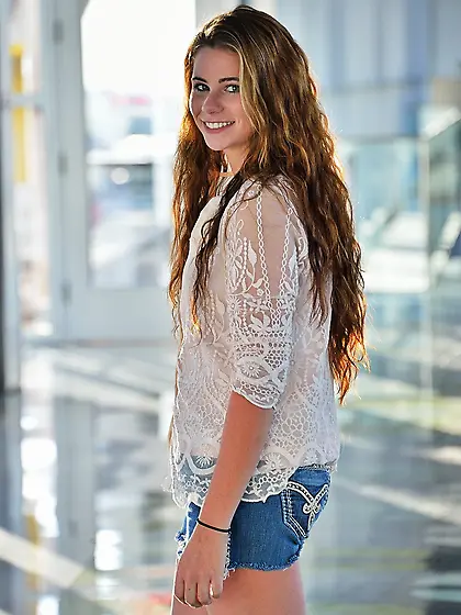 Showing off her asshole while outdoors and playing with her nips