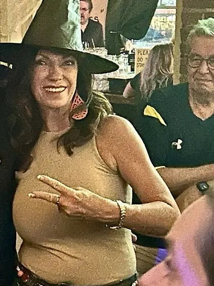 Rhonda roots for her team with her tits out