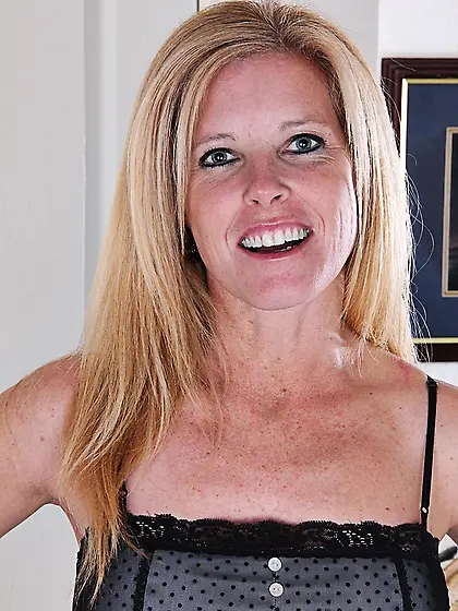 Busty blonde cougar spills