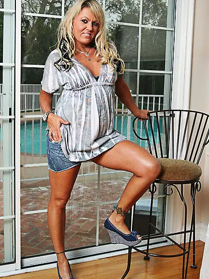 Middle aged blonde Chennin Blanc strips down to her lingerie and