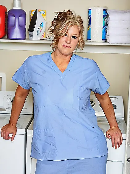 Breasty milf nurse Zoey Andrews removes her blue uniform and whi