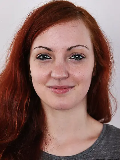 Attractive red-haired tramp grey