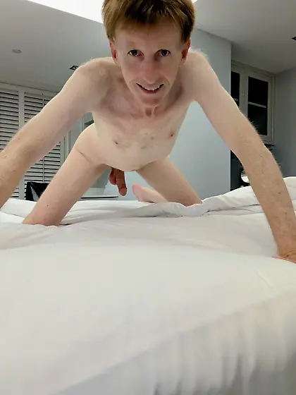 Me naked on the bed in a beautiful hotel room