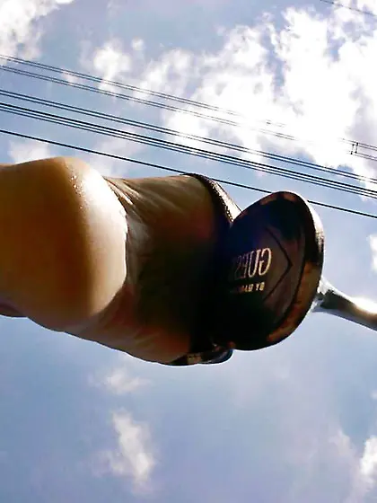 Mature dark-haired in leopard mules outside