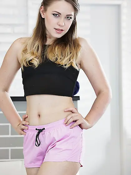 Young chick in sport outfit loves to show her small tits and bal