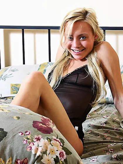 Petite smiling teen blonde Kosa Nubiles gives a closeup of her a