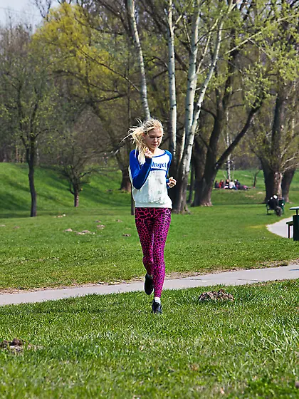 Ponytailed blonde with perky tits works out outdoors,  strips ind