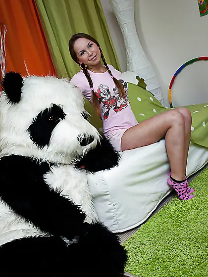Seductive pigtail teen has fun with big panda toy