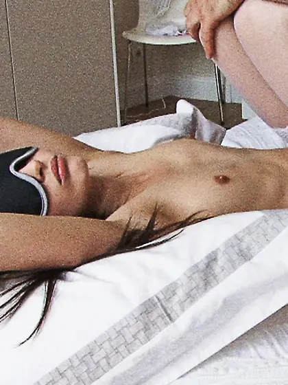 Lana laying bed face