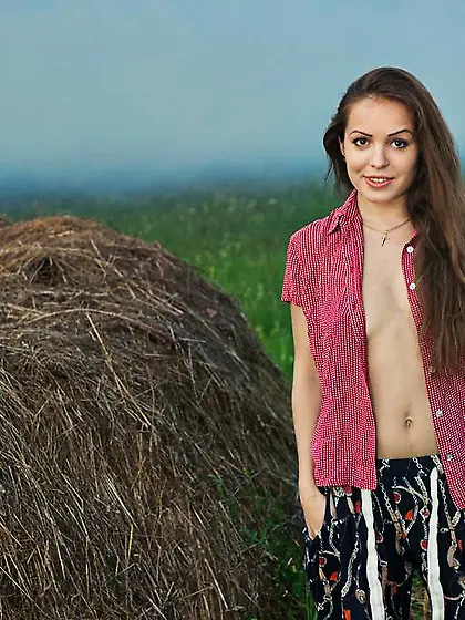 Graceful brunette babe exposing her hairy slit by the haystack V