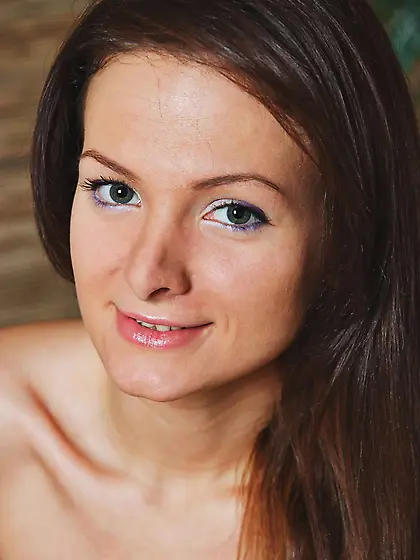 Shaved brunette Zhanet A exposes her long legs,  tasty ass and sh