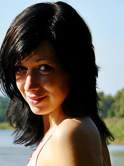 Dark-haired babe adores swimming in the local river totally nake