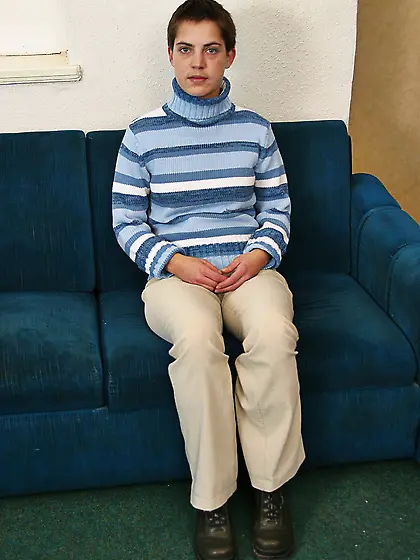 Short-haired teen brunette posing